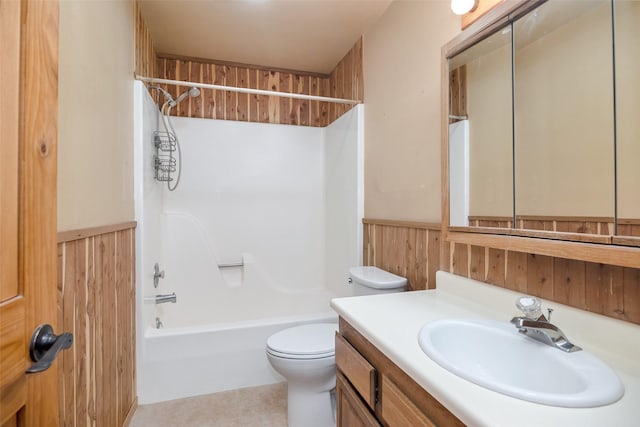 full bathroom with vanity, toilet, wooden walls, and bathing tub / shower combination