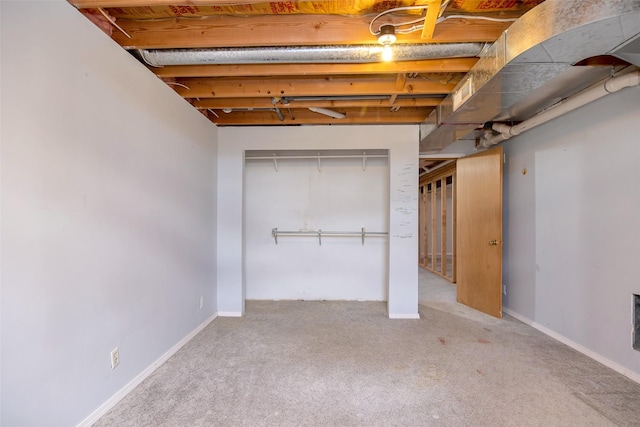 basement featuring light colored carpet