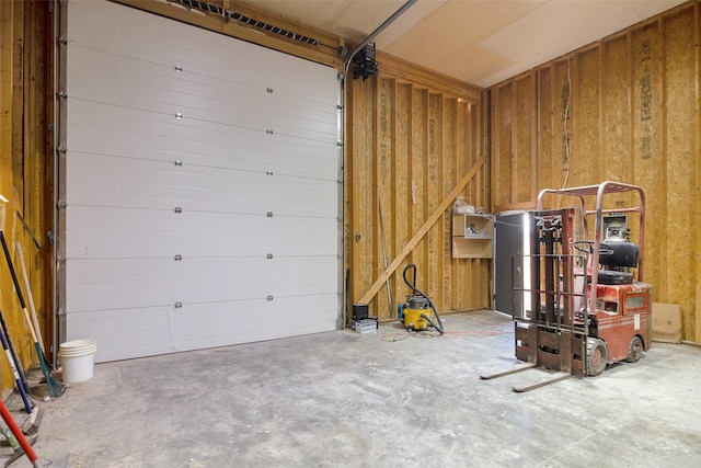 garage featuring wooden walls