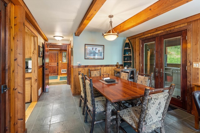 tiled dining area with french doors and beam ceiling