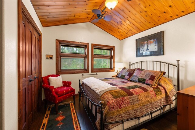 bedroom featuring a closet, ceiling fan, dark hardwood / wood-style flooring, wooden ceiling, and vaulted ceiling