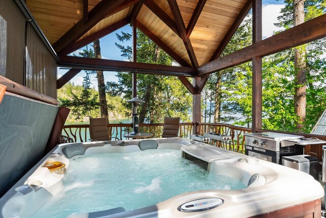 view of pool featuring a hot tub