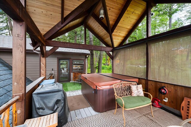 unfurnished sunroom with vaulted ceiling with beams and wood ceiling