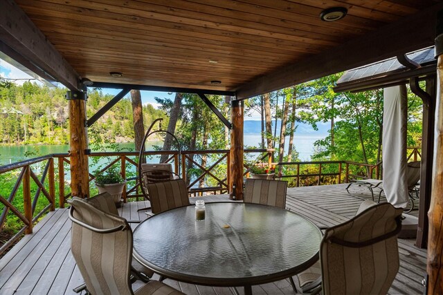 wooden deck featuring a water view