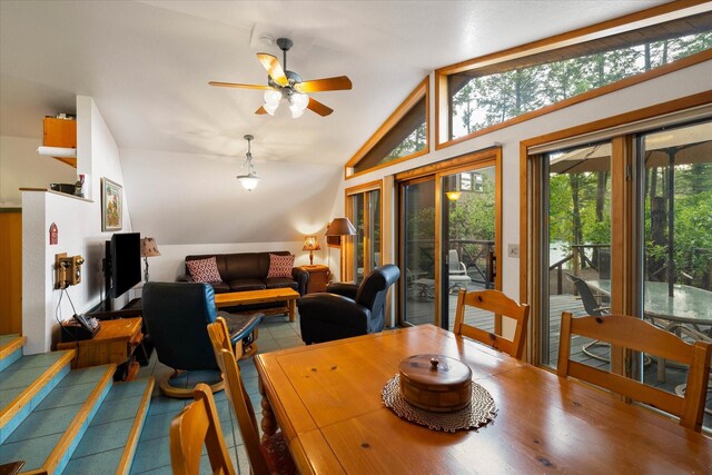 dining area featuring vaulted ceiling and ceiling fan