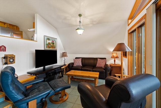 living room with tile patterned flooring and lofted ceiling