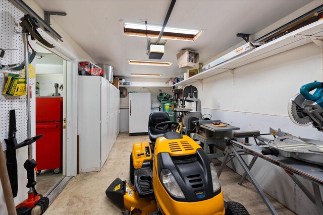 garage featuring white fridge