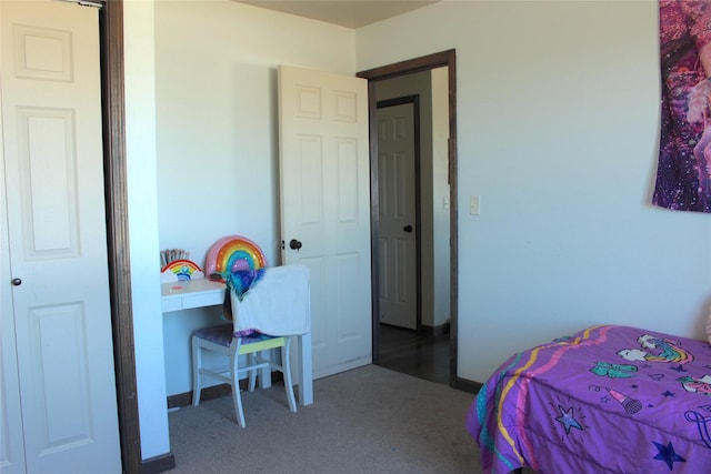 bedroom featuring a closet and carpet floors