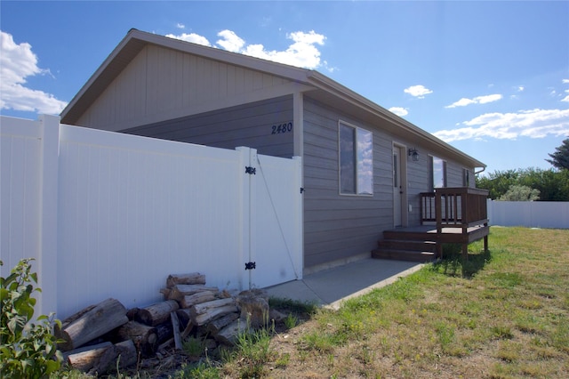 view of property exterior with a yard