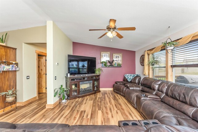 living room with vaulted ceiling, ceiling fan, and light hardwood / wood-style floors