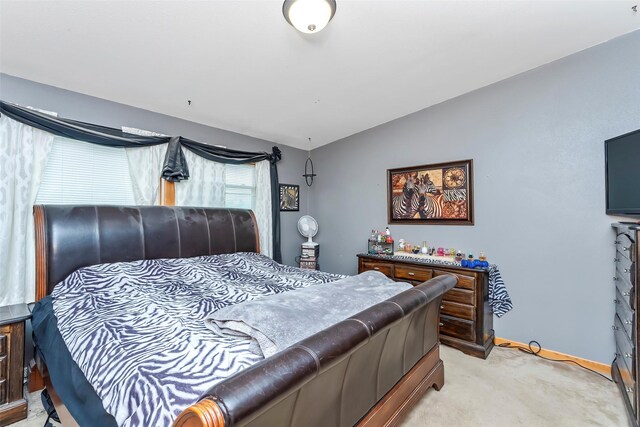 carpeted bedroom featuring vaulted ceiling