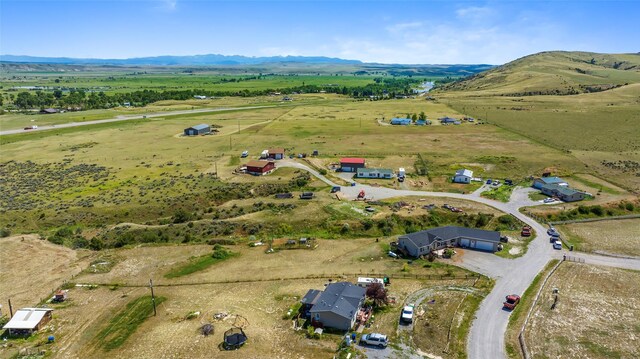 drone / aerial view with a mountain view and a rural view