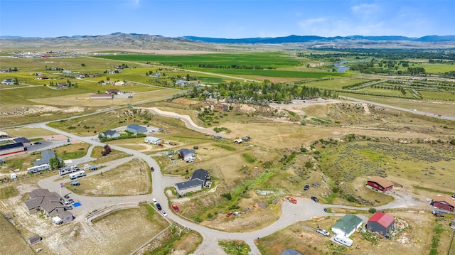 drone / aerial view with a mountain view and a rural view