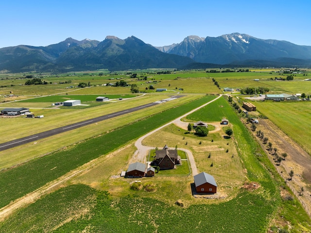 birds eye view of property featuring a mountain view and a rural view