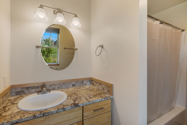 bathroom featuring vanity and shower / bath combo with shower curtain