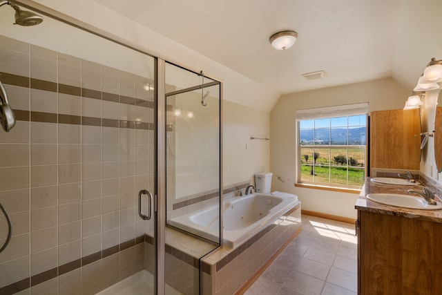 bathroom featuring tile patterned flooring, vanity, lofted ceiling, and independent shower and bath