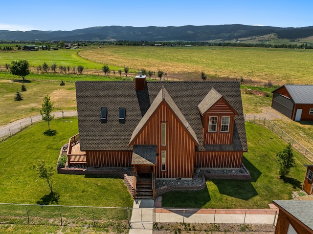 birds eye view of property with a mountain view and a rural view