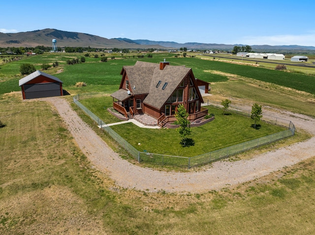 birds eye view of property with a mountain view and a rural view