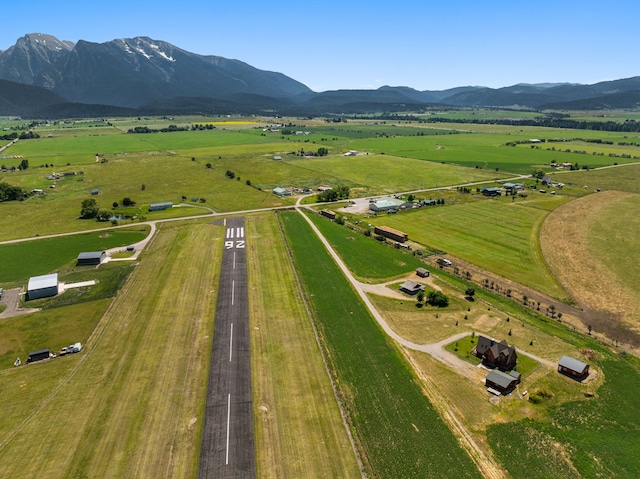 birds eye view of property with a mountain view and a rural view