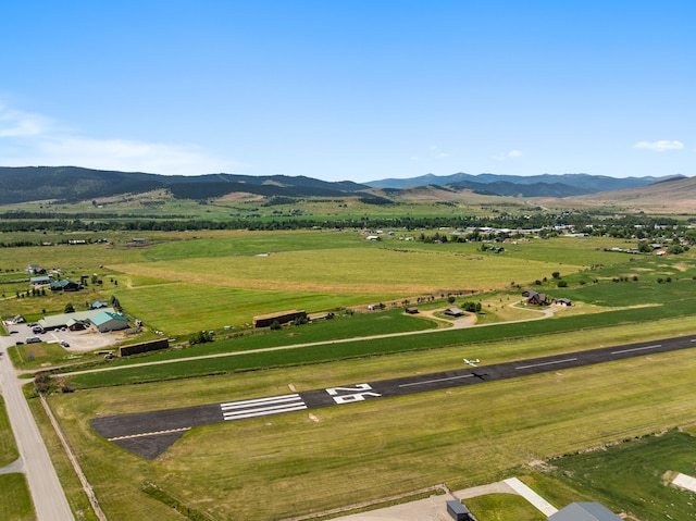 drone / aerial view with a mountain view and a rural view