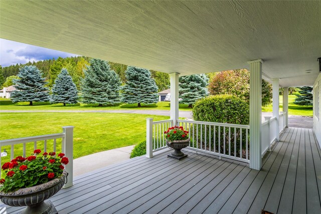 wooden terrace with a yard