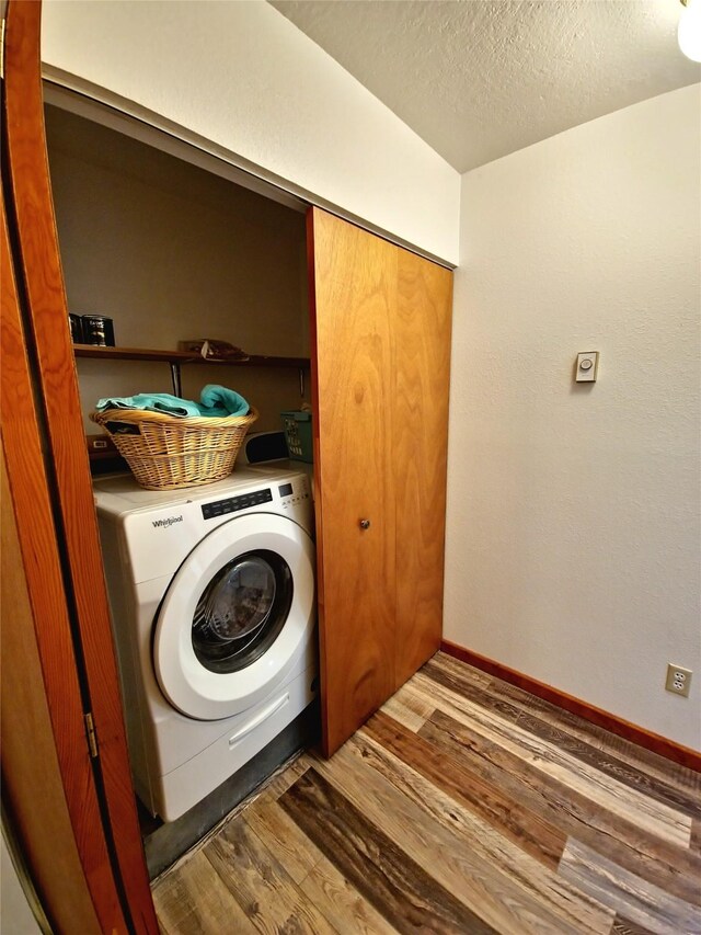 512 S Oak St, Townsend, MT 59644 - laundry area featuring a textured ceiling, baseboards, wood finished floors, laundry area, and washer / dryer