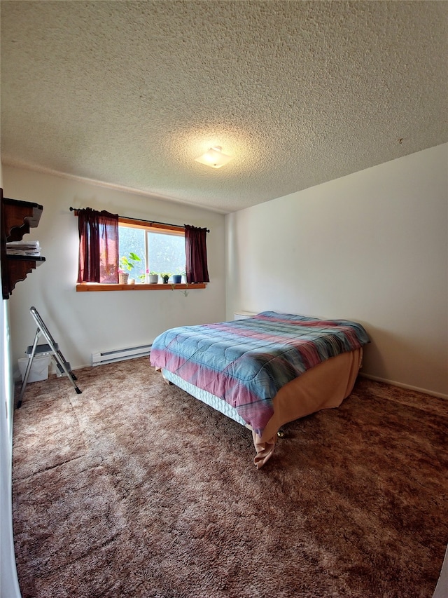 carpeted bedroom featuring a baseboard radiator and a textured ceiling