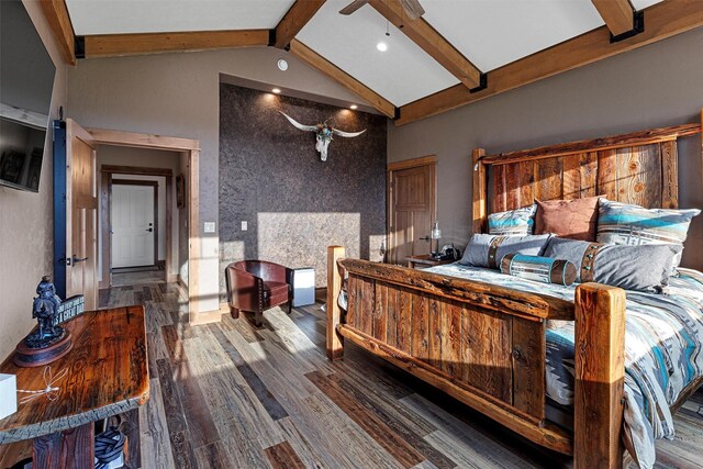 bedroom with wood-type flooring and lofted ceiling with beams