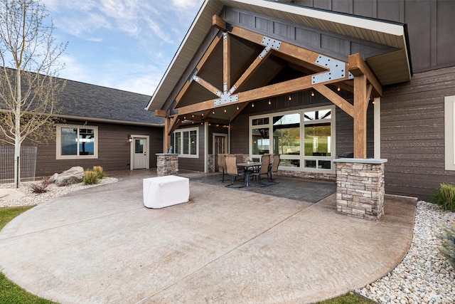 back of property featuring a patio area and a gazebo