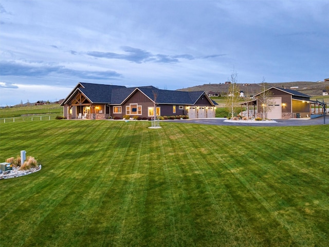 view of front of property featuring a garage and a front yard