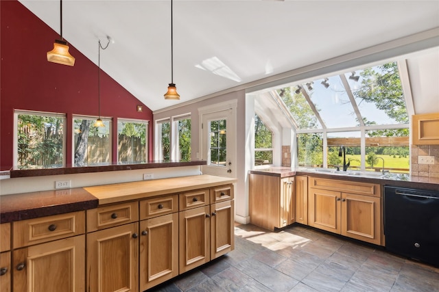 kitchen with dishwasher, decorative light fixtures, a skylight, sink, and backsplash