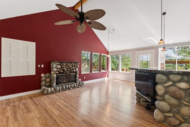 963 Colorado Ave, Whitefish, MT 59937 - living area with high vaulted ceiling, ceiling fan, a fireplace, and wood finished floors