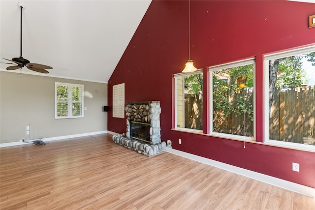 963 Colorado Ave, Whitefish, MT 59937 - unfurnished living room with high vaulted ceiling, ceiling fan, wood finished floors, and a fireplace