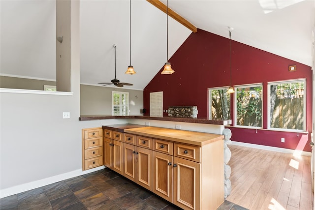 963 Colorado Ave, Whitefish, MT 59937 - kitchen featuring high vaulted ceiling, wood counters, a peninsula, a ceiling fan, and healthy amount of natural light