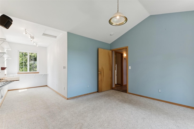 963 Colorado Ave, Whitefish, MT 59937 - carpeted spare room with vaulted ceiling and rail lighting