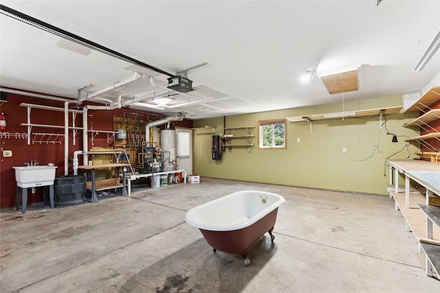 963 Colorado Ave, Whitefish, MT 59937 - garage with a workshop area, a garage door opener, and gas water heater