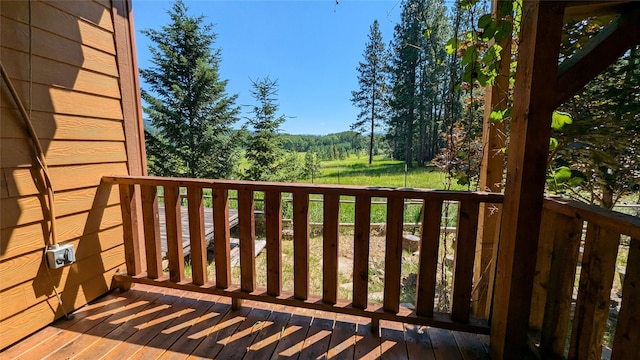 963 Colorado Ave, Whitefish, MT 59937 - wooden deck featuring a wooded view