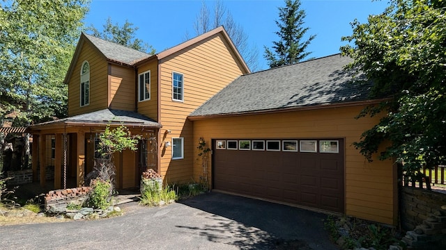 963 Colorado Ave, Whitefish, MT 59937 - view of front of property featuring driveway, a garage, and roof with shingles