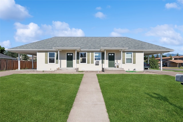 ranch-style home with a carport and a front yard