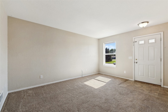 entrance foyer with carpet floors