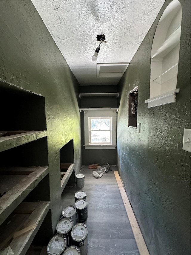 corridor featuring a textured ceiling