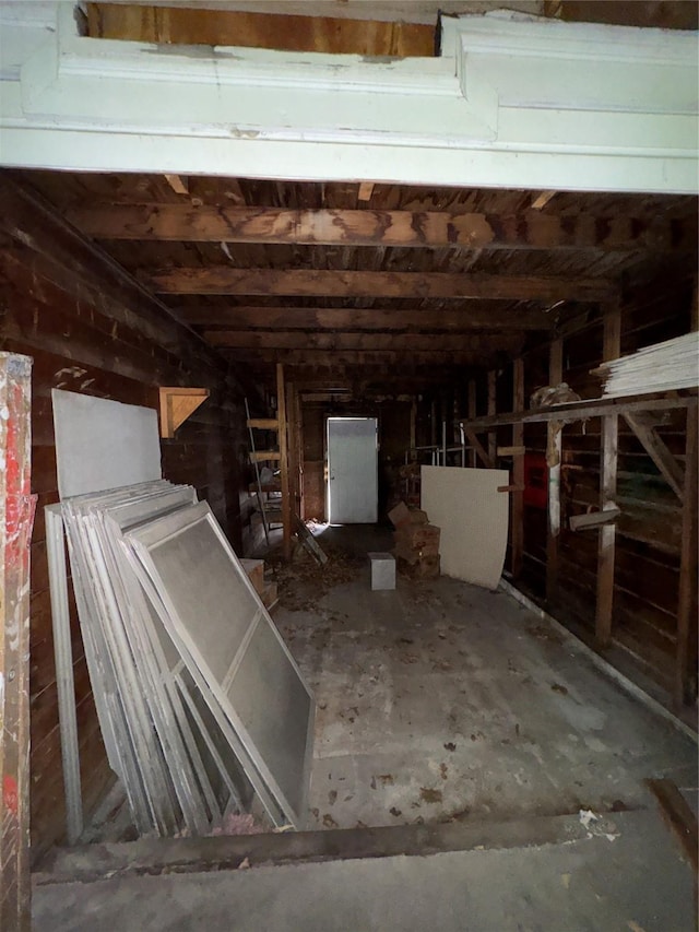 miscellaneous room featuring wooden walls