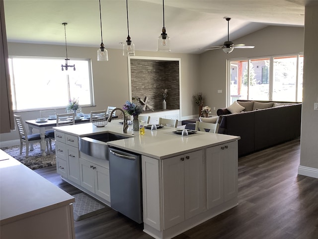 kitchen with white cabinetry, dark hardwood / wood-style flooring, sink, dishwasher, and a center island with sink