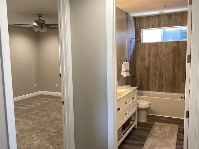 full bathroom with toilet, shower / bathtub combination, vanity, ceiling fan, and hardwood / wood-style floors