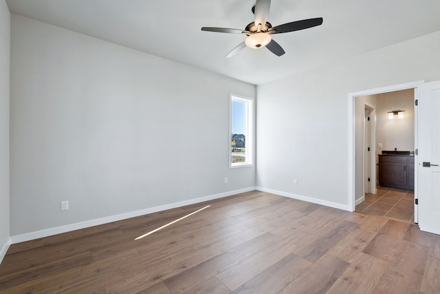 unfurnished room with ceiling fan and light hardwood / wood-style flooring