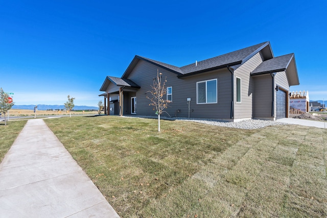 exterior space with a garage and a yard