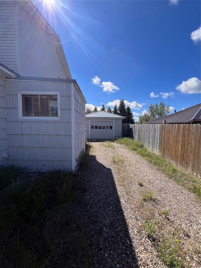 view of yard with an outbuilding and a garage