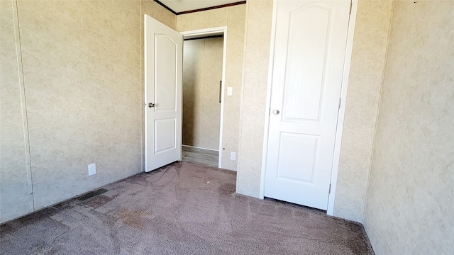 unfurnished bedroom with carpet flooring