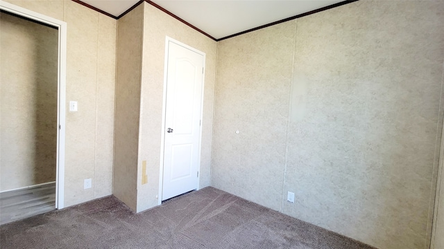 unfurnished bedroom with carpet and ornamental molding