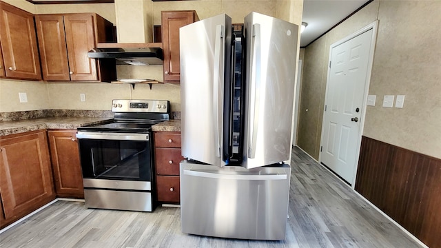 kitchen with stainless steel appliances, exhaust hood, and light wood-type flooring